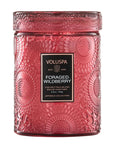 Red candle with a floral design that reads, "VOLUSPA FORAGED WILDBERRY"