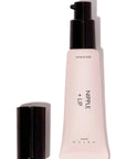Pink cosmetic tube with black cap on a white background