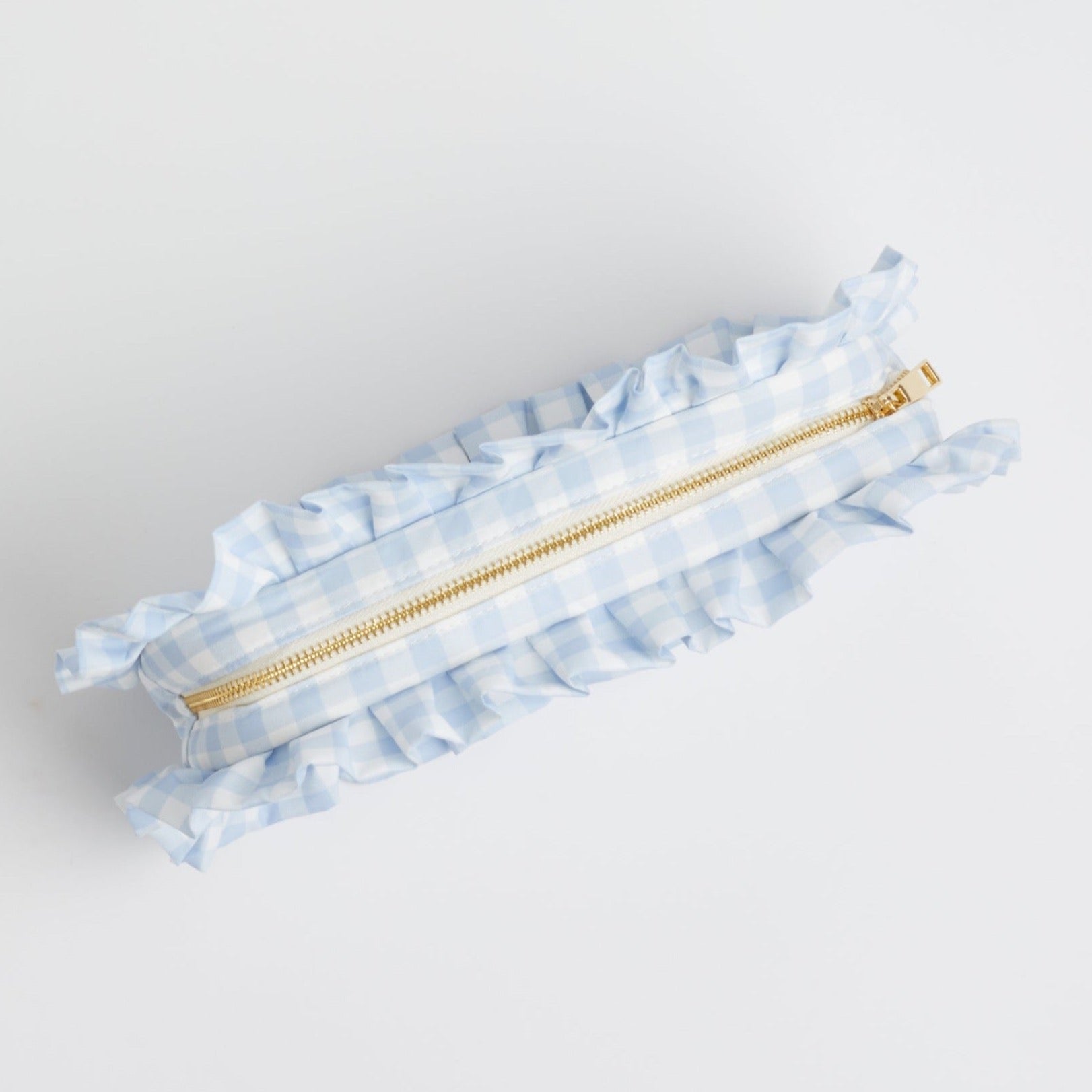 Blue Gingham Ruffle Pouch with gold zipper, on white background