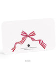 White card with a red and white striped bow on a white background
