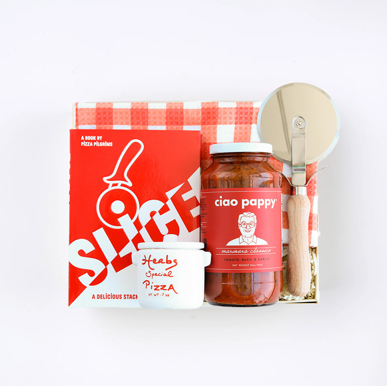 BOXFOX creme gift box packed with &quot;Slice&quot; Pizza book, wood pizza cutter, Ciao Pappy Marinara sauce, Pizza herbs jar and plaid red Geometry tea towel.