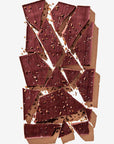 Broken chocolate bar pieces on a white background