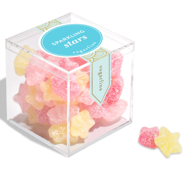 Plastic clear cube with yellow and pink star shaped gummies