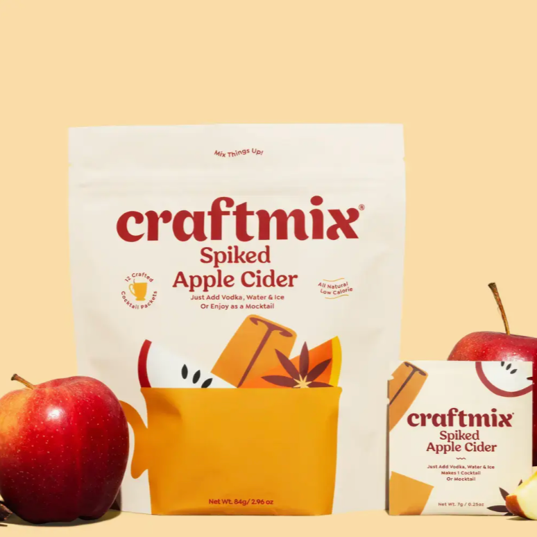 Craftmix packet featured next to an apple with yellow background. The image also features the big packaging each packet is in