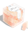 sugarfina clear box with MRS sticker on it in white and silver and inside of clear box is light pink beige peach gummies shaped like bears on white background