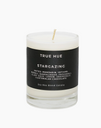 True Hue candle with a black label on a white background