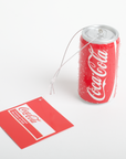 Coca-Cola tea bag and can on a white background