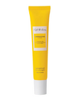 Yellow lip balm tube on a white background