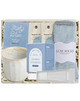 Gift set with mug, tea, and socks in a box on a white background