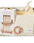 Baby gift set with books, a teether, and a hat on a white background