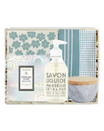 Set of cleaning products including a bottle, cloth, and bowl in a decorative box with floral pattern.