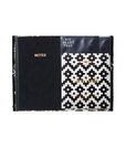 Two notebooks with black and white covers on a white background