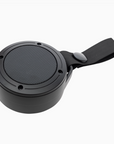Black portable speaker with a strap on a white background