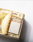 Vanilla-scented product set with matches on a light gray background