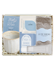 Gift set with tea, socks, and other items in a box on a white background