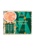 A boxed snack product labeled Goodio Craft Chocolate Peppermint Crunch, shown on a plain white background. The package includes a green front label, a smaller side label, and a photo of pink peppermint candy on popcorn.