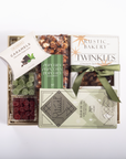 A gourmet gift box filled with assorted snacks and treats, including Rustic Bakery Twinkles, Rival chocolate, caramel corn, gummy candies, dried cranberries, and a package of popcorn, arranged on a white background.