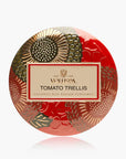 A round decorative tin of Whispa Tomato Trellis coconut wax body perfume, featuring a vibrant red background with gold and olive green botanical patterns and a central cream-colored label.