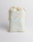 Bag of wool dryer balls on white background.