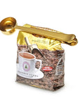 Coffee bag with gold scoop and measuring spoon on a white background