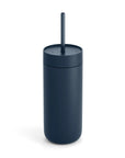 Navy blue tumbler with a straw on a white background