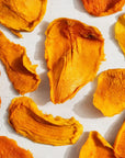 Dried mango pieces on a light background