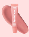 Lip balm tube with pink shade and 'esw beauty' branding on a matching pink background