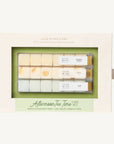 A boxed set of Luxe Mixer Cubes coffee and tea flavoring cubes, featuring a cream-colored outer box with a clear window showing three rows of small flavor cubes, and a green and cream label at the bottom reading 'Afternoon Tea Time CAFE SET'.