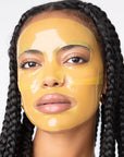 girl wearing translucent yellow sheet mask