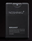 Black hand sanitizer bottle with 'Noshinku' branding on a black background