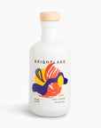 Brightland Lucid 100% Lemon Olive Oil in a white glass bottle with a light wood cap, featuring a colorful abstract label.