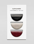 Set of three eclipse bookmarks on a white card with 'Cloth & Paper' branding.