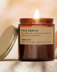 Candle with a label on a soft, warm background