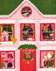 Puzzle of a pink house with windows and a door, featuring Christmas decorations.