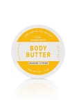 Jar of body butter with a white lid and yellow label on a white background