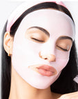 girl wearing light pink sheet mask