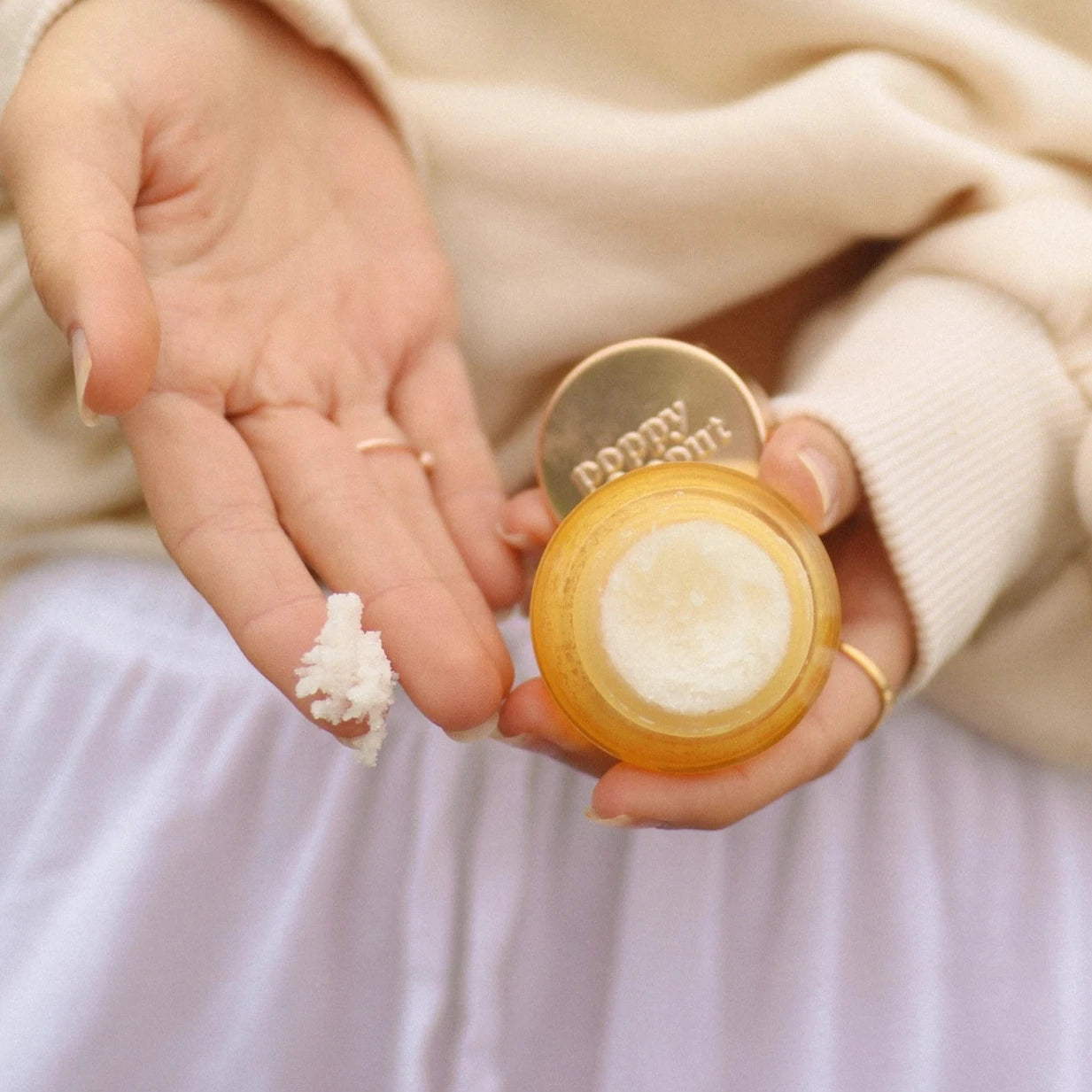 girl holding lip scrub