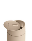Beige container with a lid on a white background
