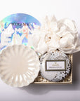 A luxury eye makeup remover gift set in a wooden box, featuring a round iridescent lid with 'ITAMA QUE DIAMOND EYE' text, a white ceramic brush, a white silk eye mask, and a round packaged product labeled 'VOLUSPA MOKARA ORCHID'.