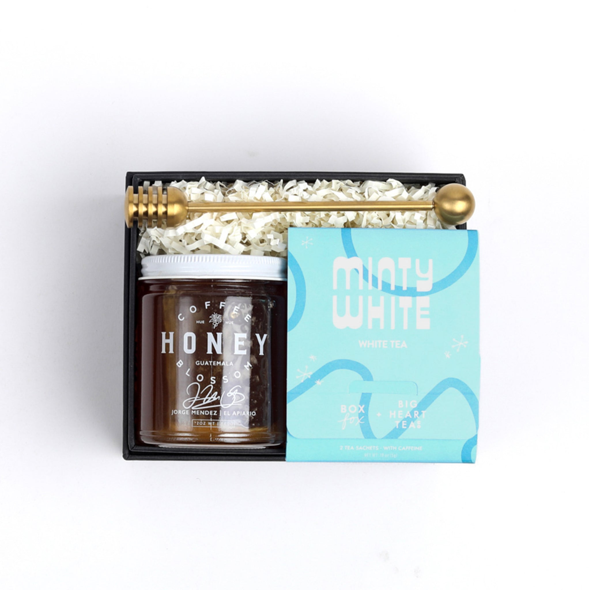 BOXFOX Black gift box packed with gold honey dipper, jar of honey and blue minty why tea sachet
