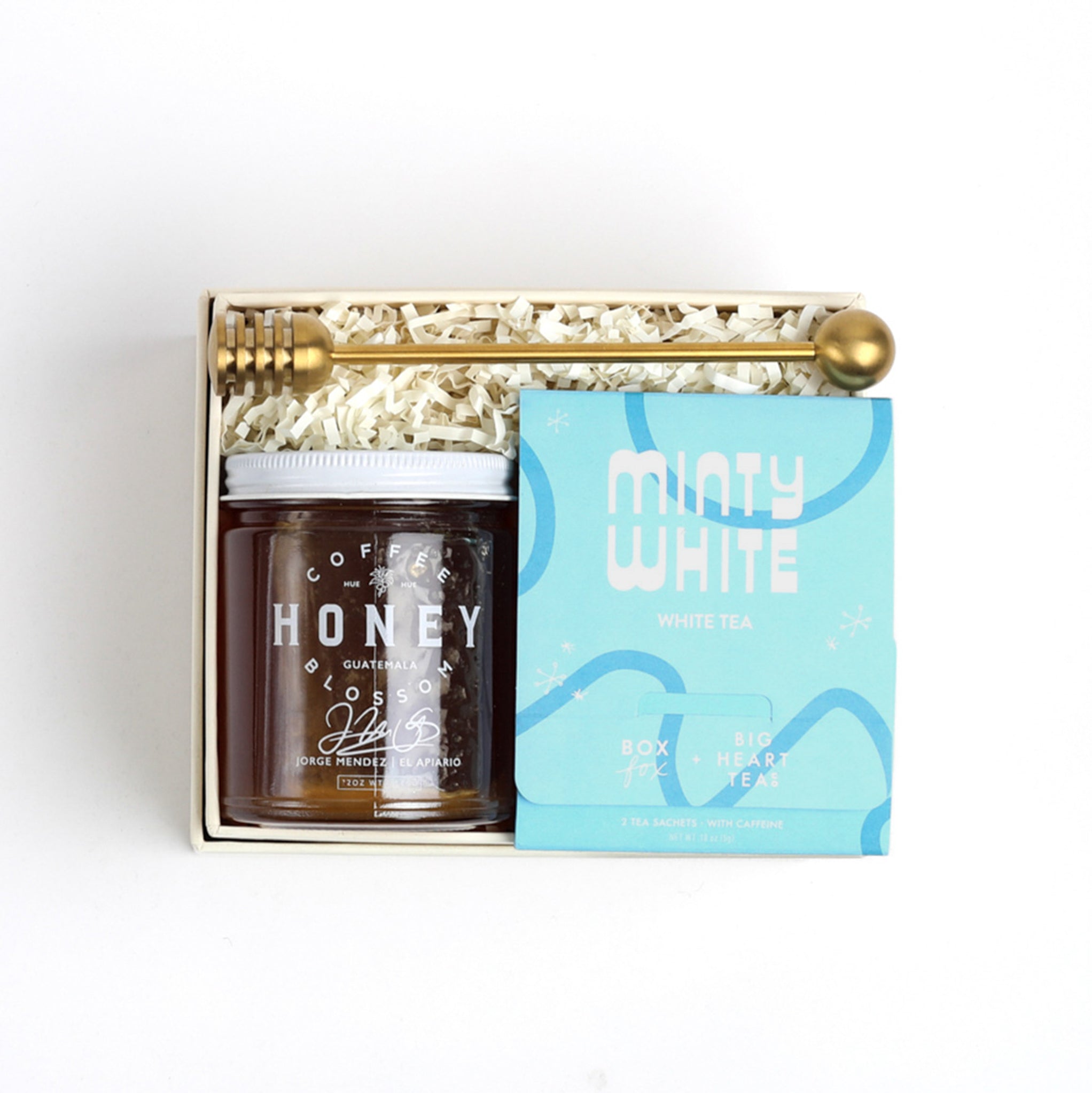 BOXFOX Creme gift box packed with gold honey dipper, jar of honey and blue minty why tea sachet