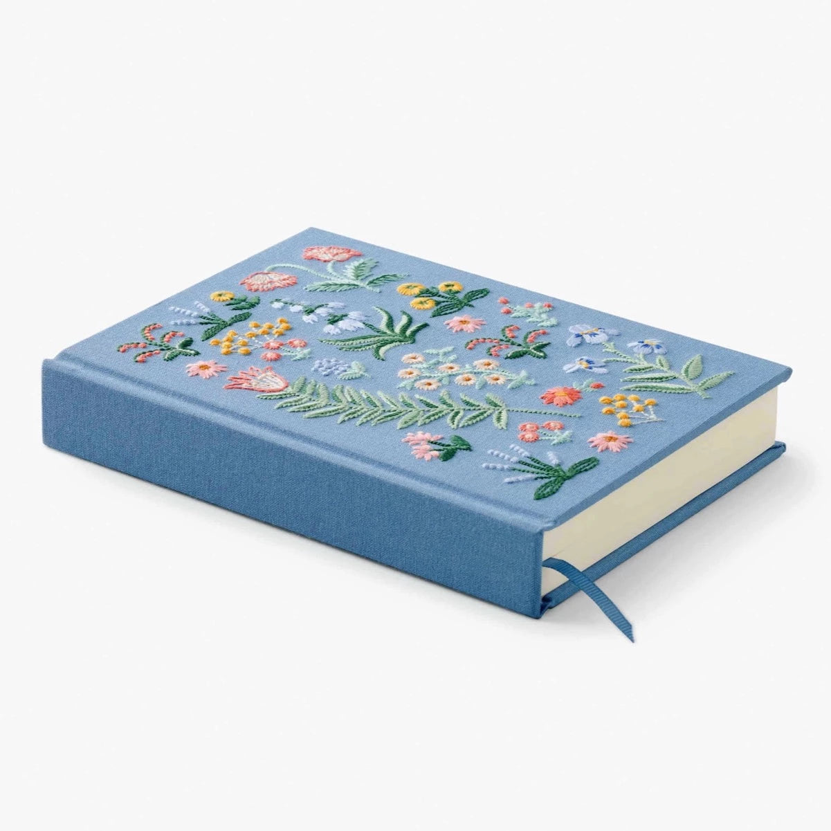 Side view of light blue fabric covered notebook.  Can see the blue bookmark and flowers on the top