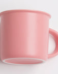 Pink mug on a light gray background