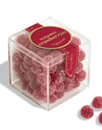 Clear cube box filled with sugared cranberries on a white background