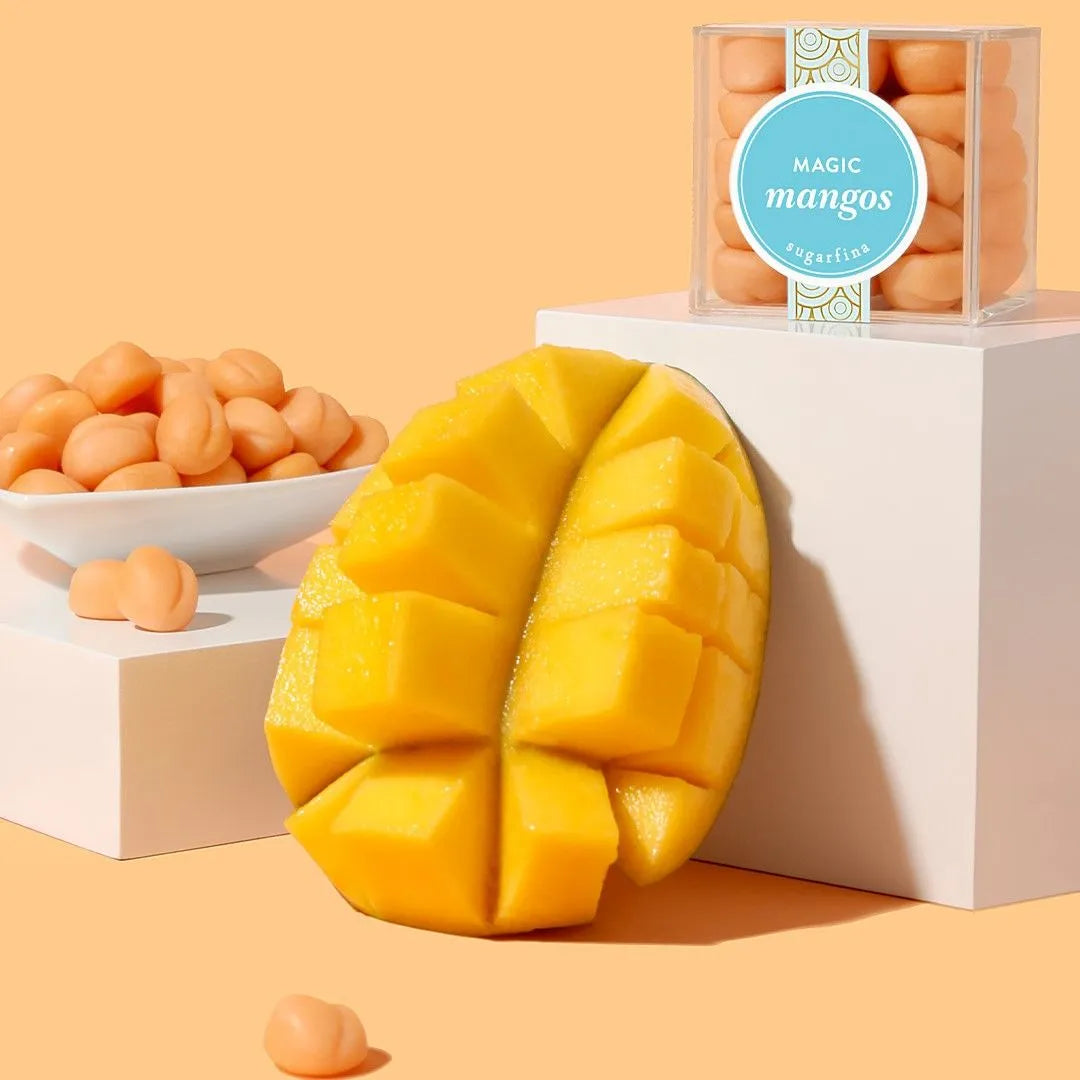 MAGIC MANGOS in dish, candy cube and next to sliced mango