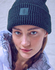 Woman wearing a black fleece beanie