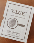 Clue Board Game on wood table.