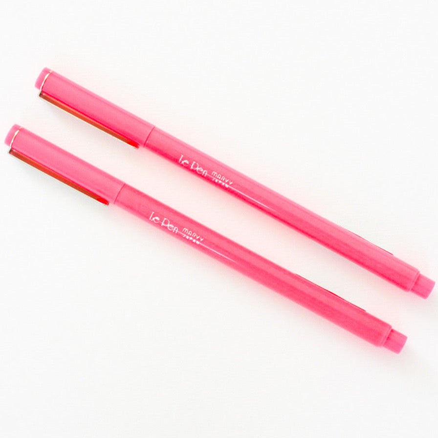 Two pink pens on white background.