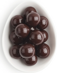 dark chocolate balls in white oval dish