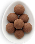 cocoa dusted cold brew chocolate bites inside white oval dish